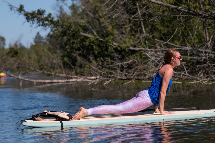 Woman performing yoga on SUP in Door County, Wisconsin