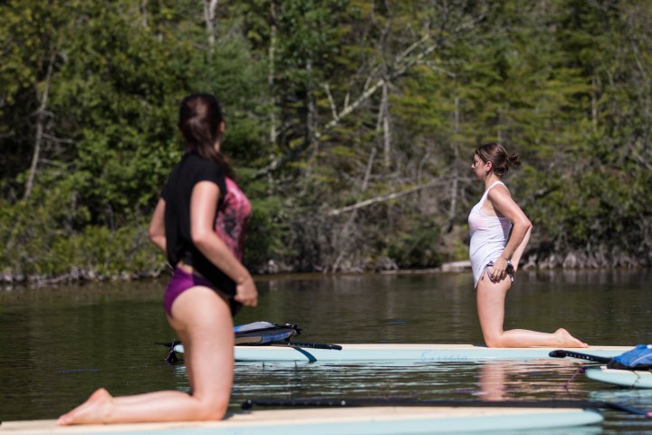 Woman participating in SUP yoga in Door County, Wisconsin