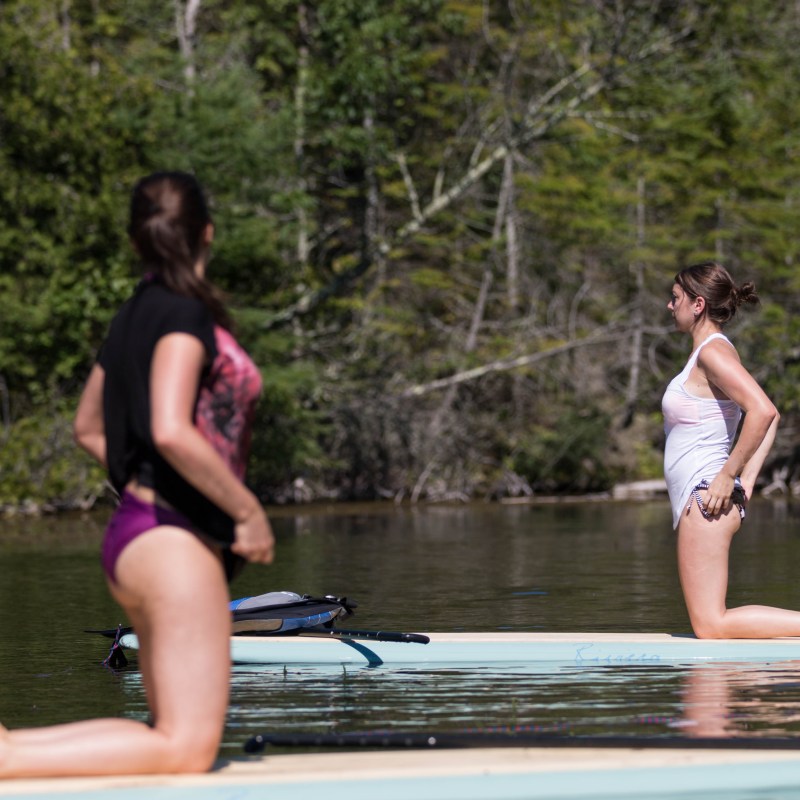 Woman participating in SUP yoga in Door County, Wisconsin