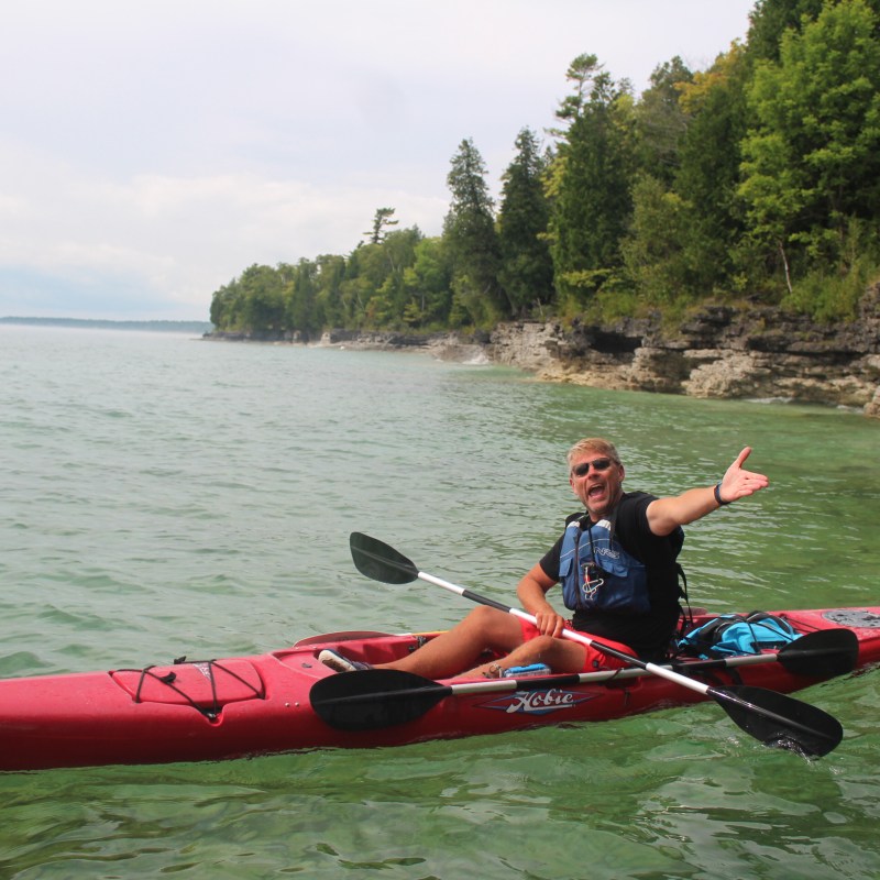 A man kayaking in Door County, Wisconsin