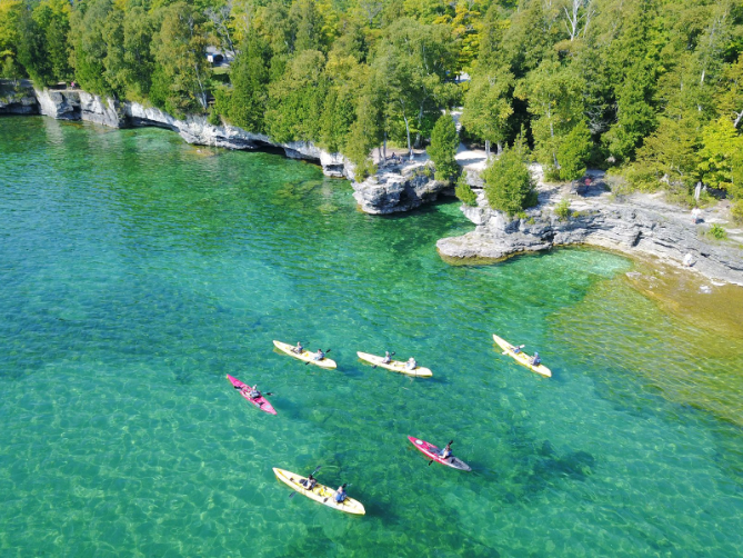 Door County coastline with kayaks in water