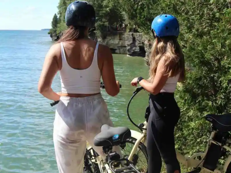 a couple of people that are standing in the water