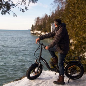 a man riding a motorcycle in the water