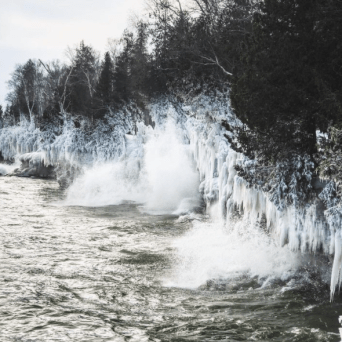 a large waterfall over a body of water