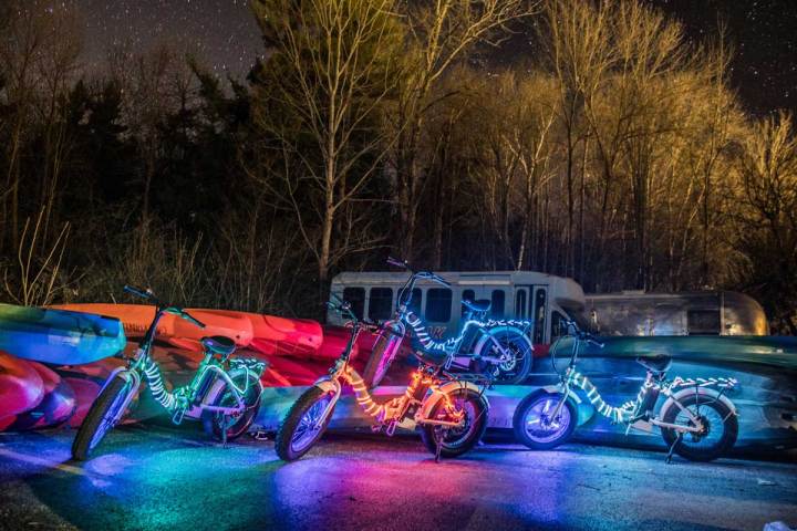 a motorcycle is parked on the side of a lake