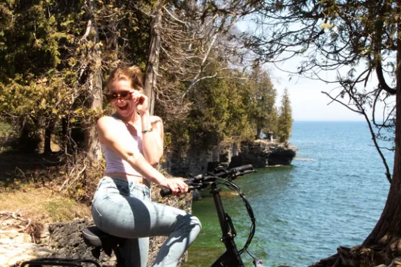 a person riding a motorcycle posing for the camera