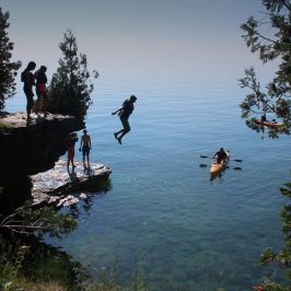 a group of people swimming in a body of water