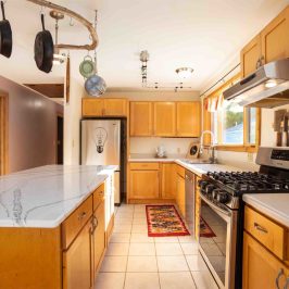 a kitchen with a stove top oven