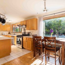 a kitchen with a dining room table