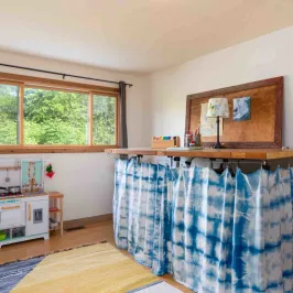 a bedroom with a large window