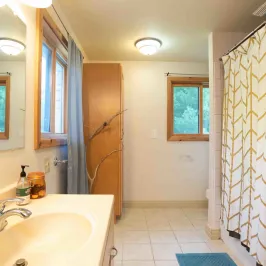 a room with a sink and a mirror