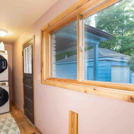 a hallway with a dishwasher and a window