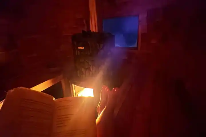 a close up of a fire place sitting in a dark room